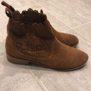Brown booties with cutout details